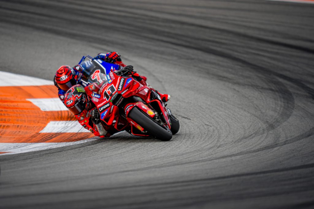 Ducati Lenovo Team ends the 2025 MotoGP season in Valencia with Bulega finishing fifteenth and Bagnaia retiring after an early crash, as the squad celebrates the Teams’ and Constructors’ titles.