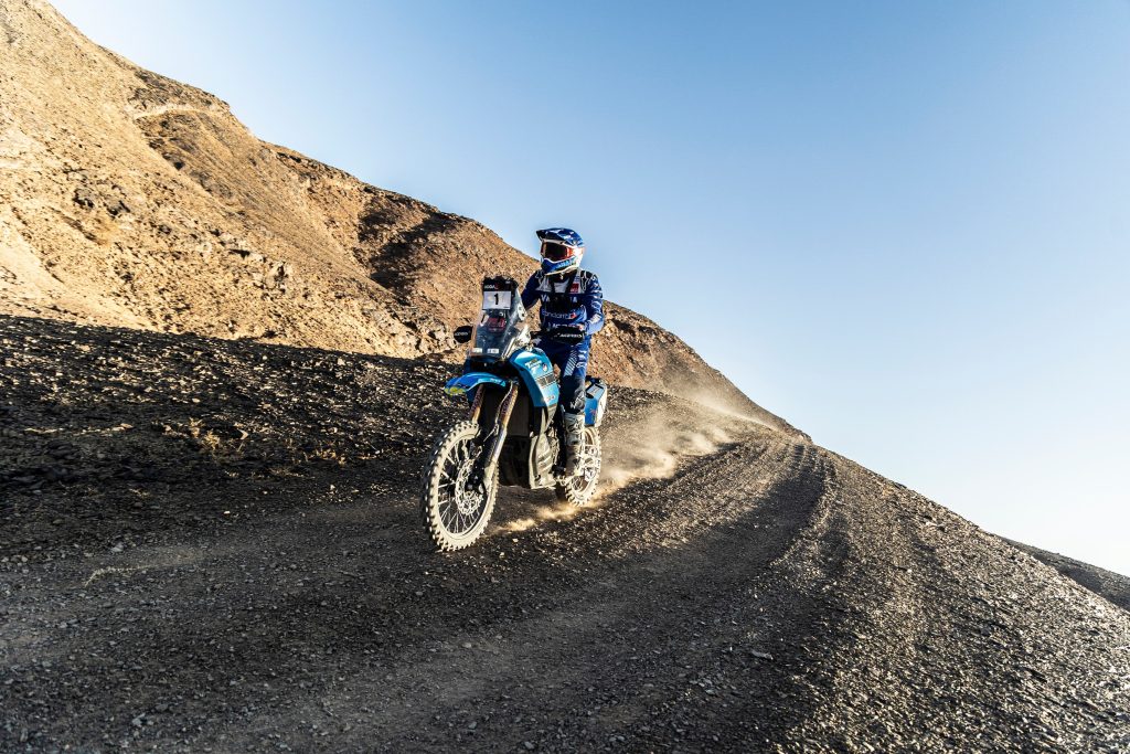 Yamaha’s Alessandro Botturi storms to victory in Stage 2 of the Addax Rally after a 15-minute penalty setback, while teammate António Maio withdraws following a crash.